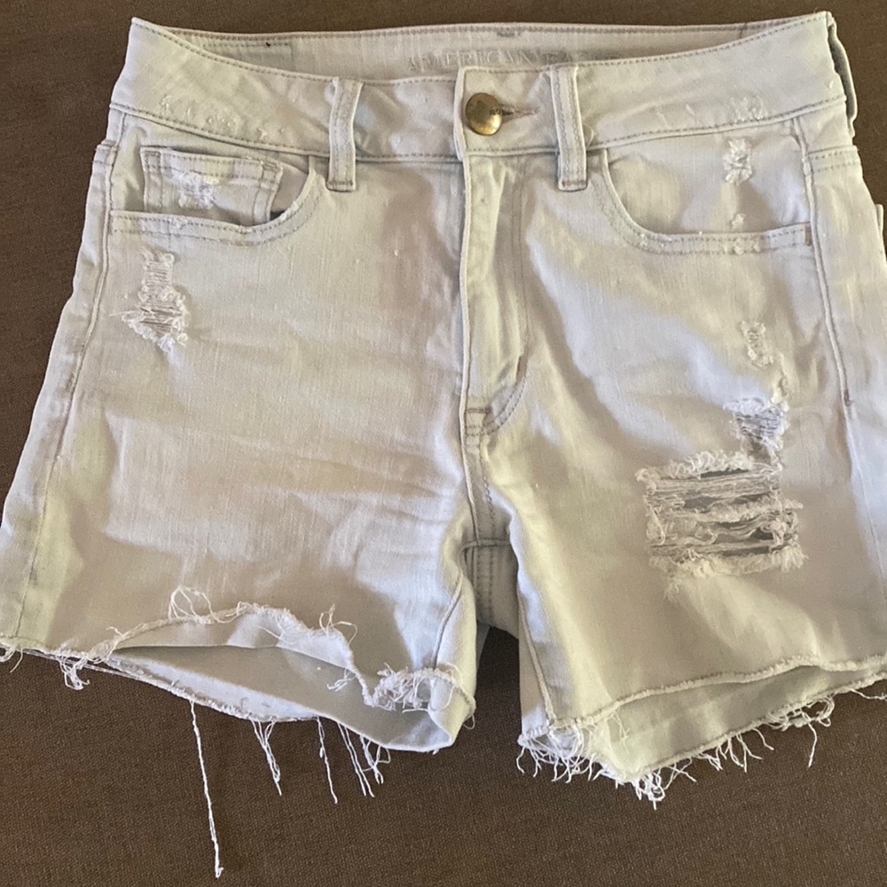 Light denim distressed shorts